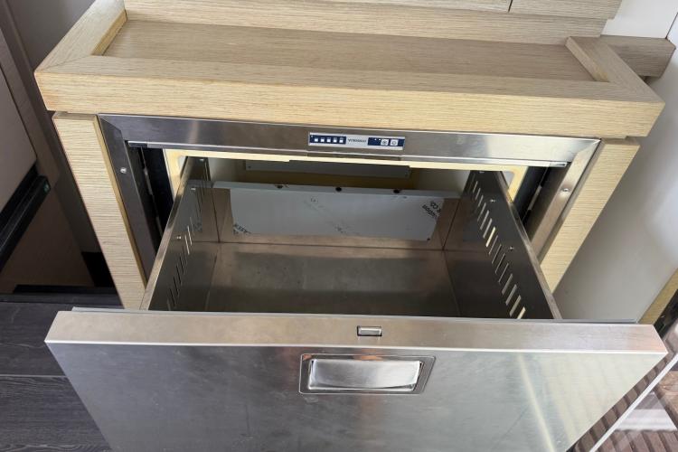 Open stainless steel drawer in 2020 Fountaine Pajot Astrea 42 yacht interior.