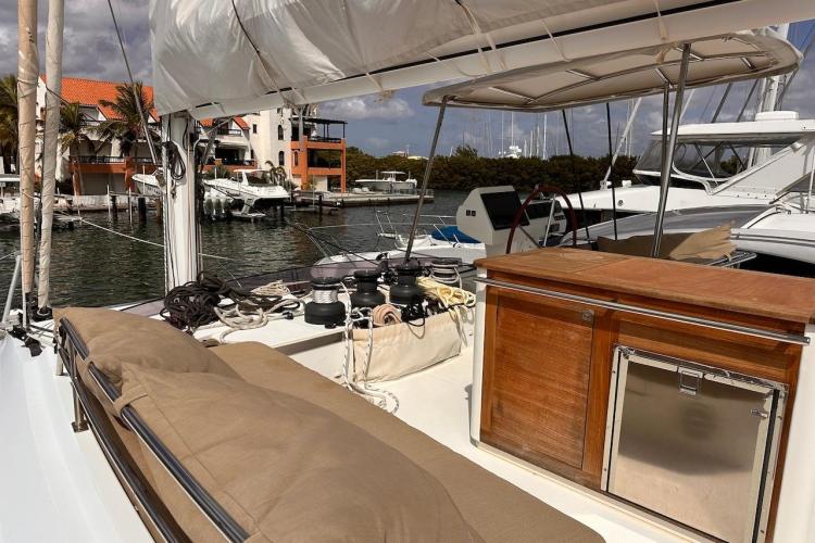 2016 Fountaine Pajot Ipanema 58 yacht deck with seating and marina view.