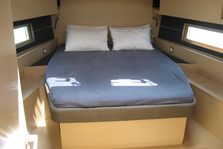 Cozy cabin interior of 2019 Beneteau Oceanis 46.1 yacht with double bed.