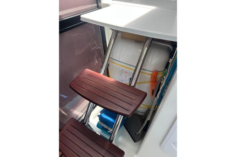 Interior of 2023 Fountaine Pajot Astrea 42 Catamaran with wooden steps and safety equipment.