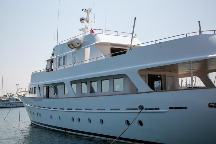 1972 Benetti 33 yacht docked in a marina, showcasing classic design and elegance.