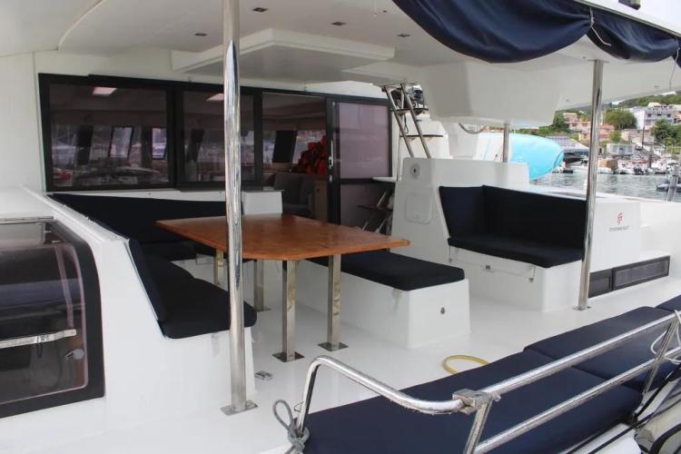 2017 Fountaine Pajot SABA 50 yacht deck with seating and dining area.