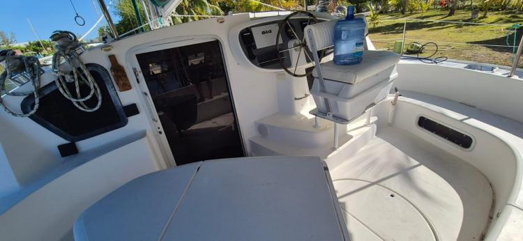 Cockpit of 1999 Fountaine Pajot Bahia 46 catamaran with steering wheel and seating area.