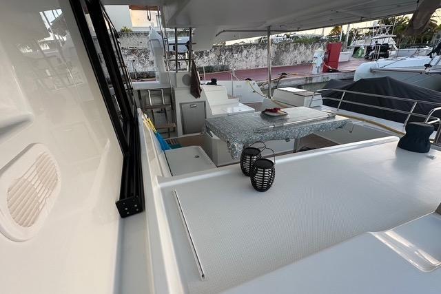 2023 Fountaine Pajot Elba yacht deck with modern seating and table setup.