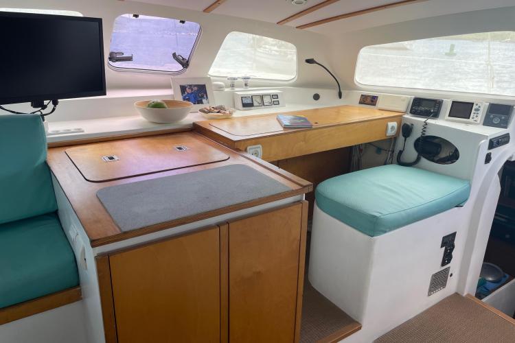 Interior of 2010 Custom KSENIA 149 yacht with navigation station and seating area.