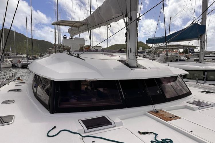 2016 Fountaine Pajot Ipanema 58 catamaran docked at marina, showcasing sleek design and spacious deck.