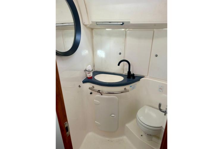 Bathroom interior of 2006 Bavaria Cruiser 46 yacht, featuring sink and toilet.