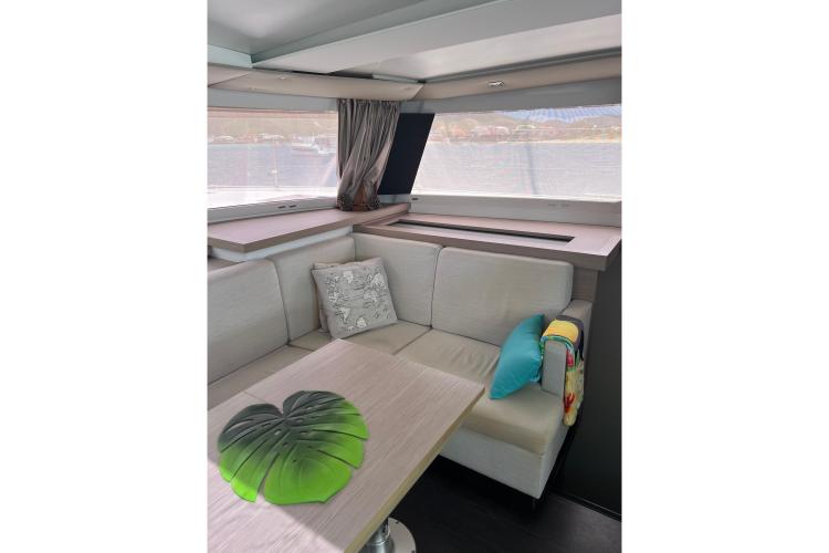Luxurious interior of 2023 Fountaine Pajot Astrea 42 Catamaran with elegant seating and decor.