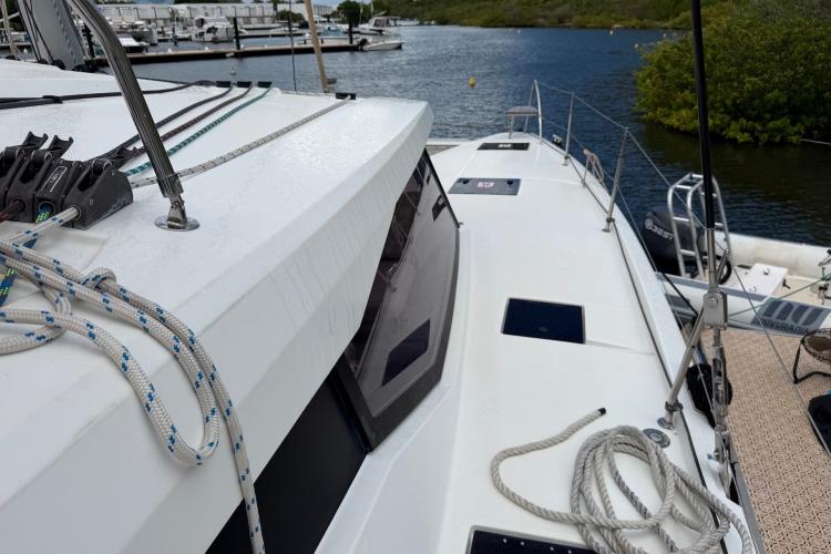 2020 Fountaine Pajot Astrea 42 catamaran docked, showcasing deck and rigging details.