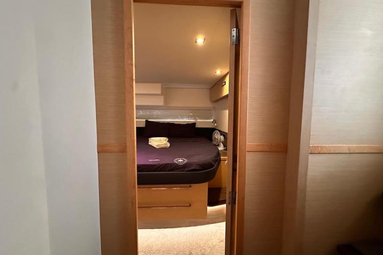 Cabin interior of 2016 Fountaine Pajot Ipanema 58 yacht, featuring a cozy bed.