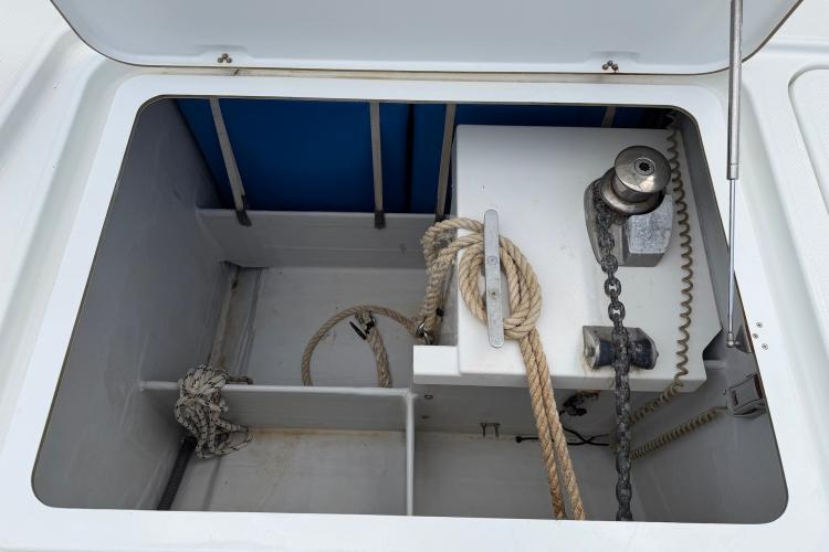 Anchor locker of 2020 Fountaine Pajot Astrea 42 catamaran with ropes and chain.