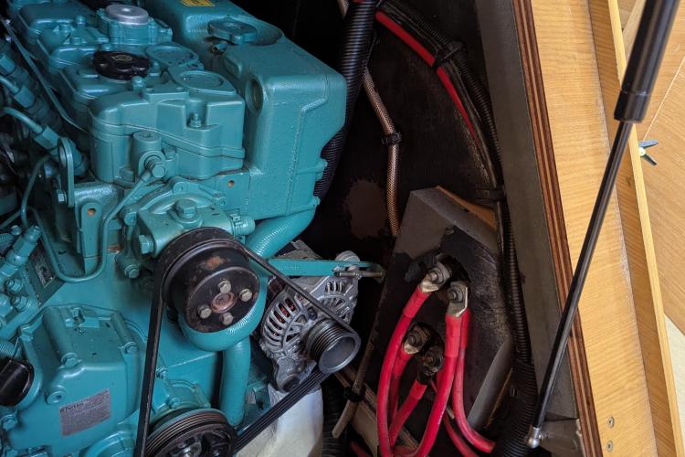 Engine compartment of a 2017 Dufour 460 Grand Large sailboat, showcasing mechanical components.