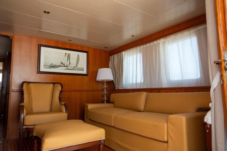 Luxurious interior of 1972 Benetti 33 yacht with elegant seating and nautical decor.