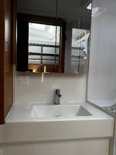 Modern bathroom sink in 2024 Excess 11 model yacht, featuring sleek design and mirror.