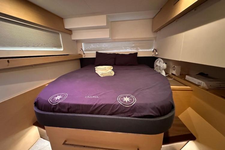 Luxurious cabin interior of 2016 Fountaine Pajot Ipanema 58 yacht with cozy bed.