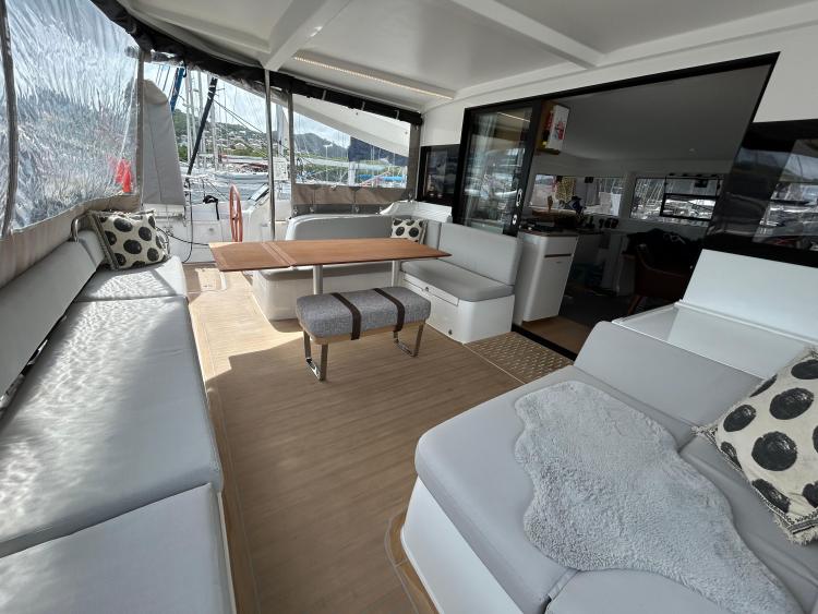 Luxurious 2024 Excess 14 yacht interior with spacious seating and modern design.