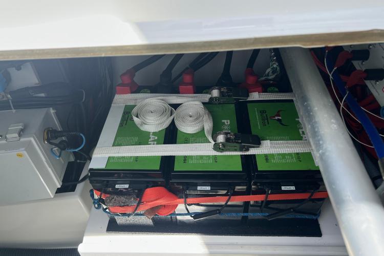 Battery compartment of 2023 Fountaine Pajot Astrea 42 Catamaran, featuring secured lithium batteries.