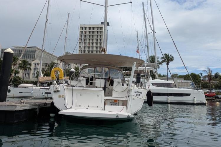 2017 Dufour 460 Grand Large yacht docked at marina with other boats.