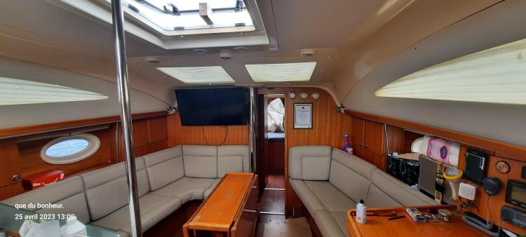 Interior of 2007 Elan Impression 434 yacht with cozy seating and modern amenities.