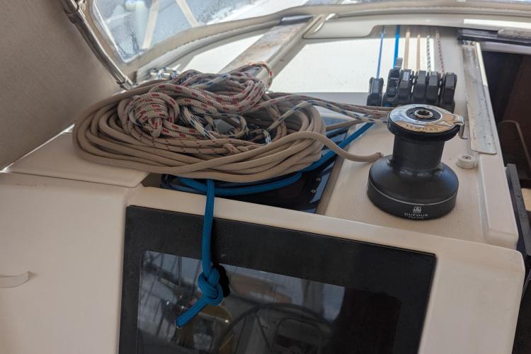 Coiled ropes and winch on 2017 Dufour 460 Grand Large sailboat deck.