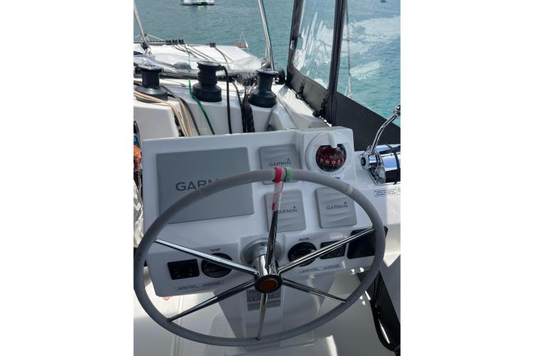 Helm of 2023 Fountaine Pajot Astrea 42 Catamaran with Garmin navigation system.
