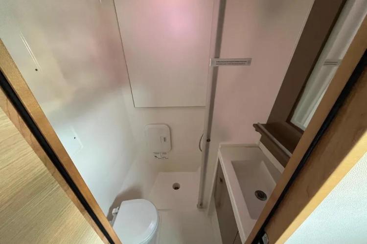 Bathroom interior of 2017 Fountaine Pajot SABA 50 catamaran, featuring toilet and sink.