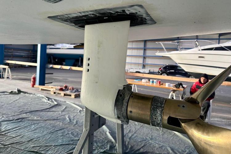 Close-up of Bavaria Cruiser 46 (2006) sailboat propeller in a maintenance facility.