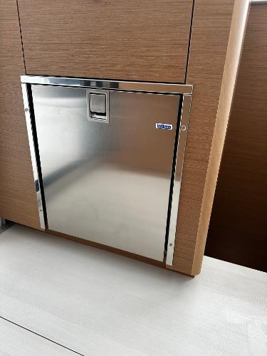 Stainless steel door on 2024 Excess 11 yacht interior.