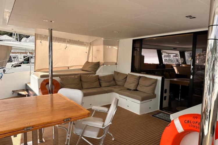 Luxurious 2016 Fountaine Pajot Ipanema 58 yacht interior with cozy seating and dining area.