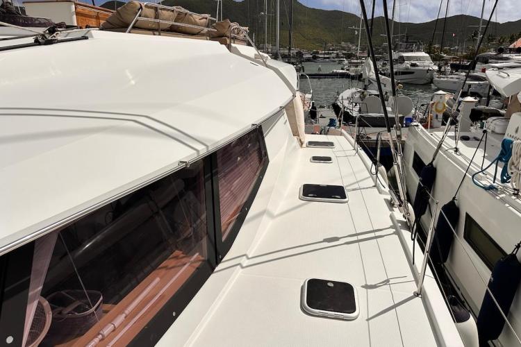 2016 Fountaine Pajot Ipanema 58 catamaran docked in a marina, showcasing sleek design.