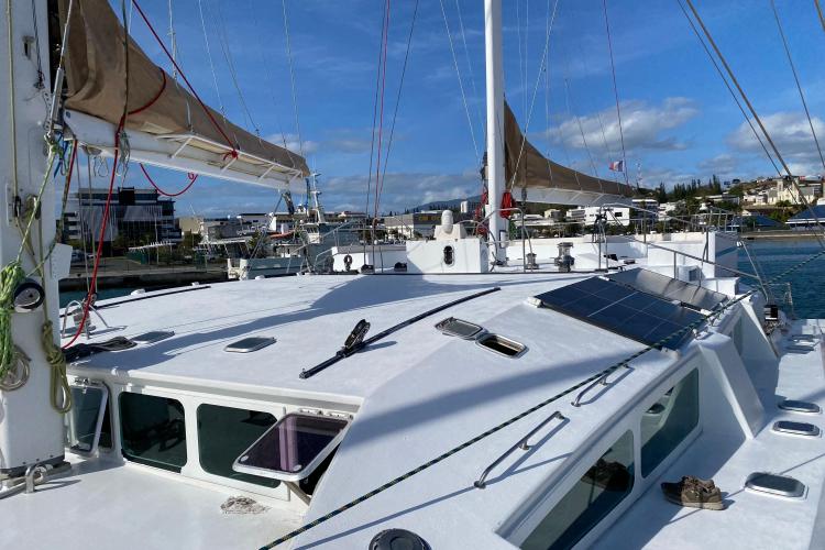 Sailing yacht Etoile Marine NAUTILUS 360, 2004 model, docked with solar panels on deck.