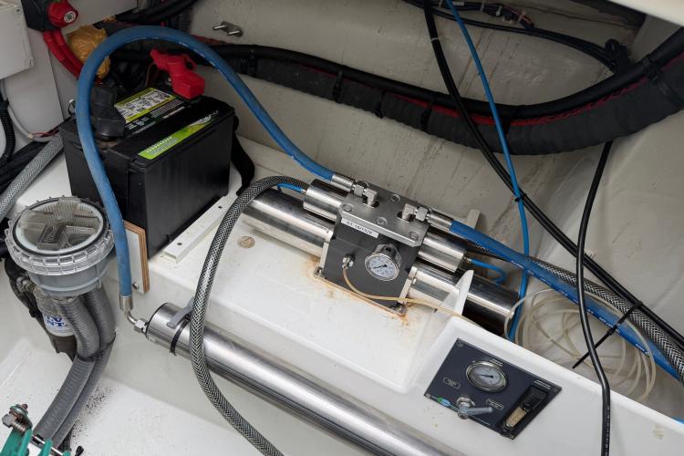 Engine compartment of 2020 Fountaine Pajot Astrea 42 with battery and hydraulic system.