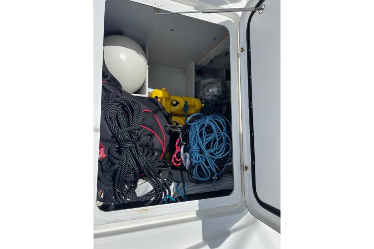 Storage compartment of 2023 Fountaine Pajot Astrea 42 Catamaran with ropes and equipment.