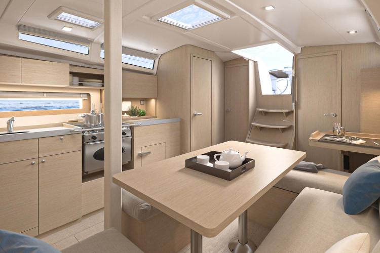 Manufacturer Provided Image: Luxurious interior of 2026 Beneteau Oceanis 37.1 yacht with modern kitchen and seating area.