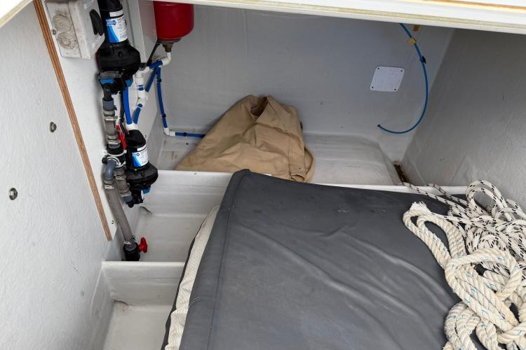 Interior storage compartment of 2020 Fountaine Pajot Astrea 42 catamaran with ropes and equipment.