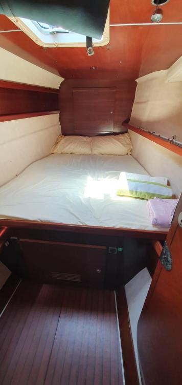 Cozy cabin interior of 1999 Fountaine Pajot Bahia 46 catamaran with wooden finish.