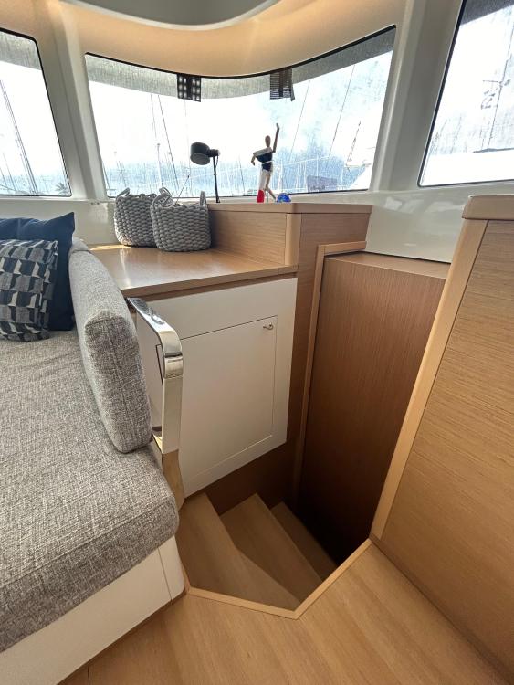 Interior of 2024 Excess 14 yacht with stairs and modern seating area.