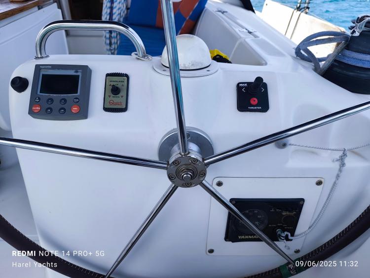 Steering wheel and controls of a 2005 Beneteau Cyclades 43.3 yacht.