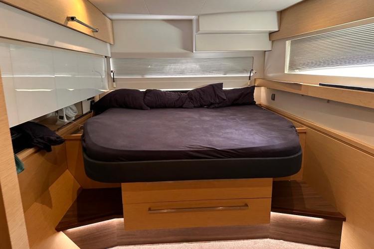 Luxurious cabin interior of 2016 Fountaine Pajot Ipanema 58 yacht with cozy bed.