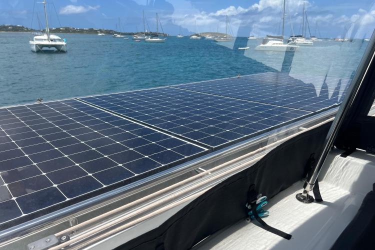 Solar panels on a 2023 Fountaine Pajot Astrea 42 Catamaran, anchored in a scenic bay.