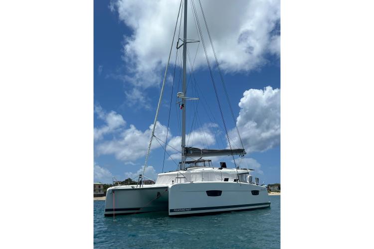 2023 Fountaine Pajot Astrea 42 Catamaran sailing under a clear blue sky.