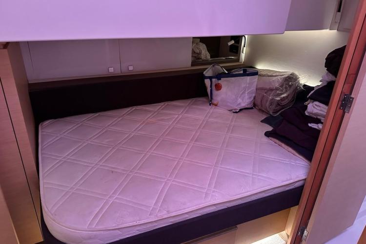 Cabin interior of 2016 Fountaine Pajot Ipanema 58 with bed and storage.