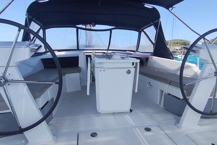 Cockpit of 2019 Beneteau Oceanis 46.1 sailboat with dual steering wheels and seating.