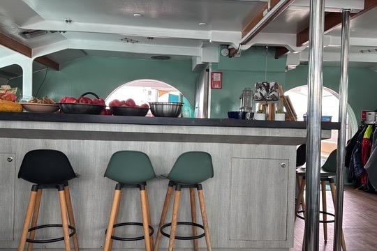 Interior of 2004 Etoile Marine Maxi Cat 24 with modern bar and stools.