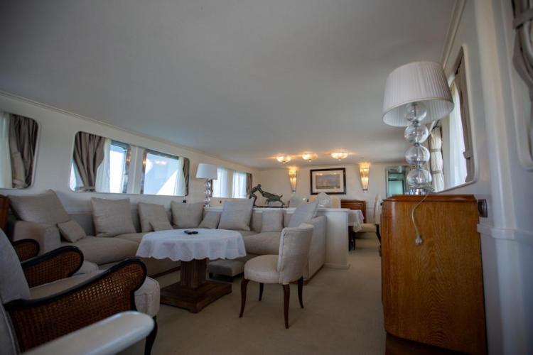 Luxurious interior of 1972 Benetti 33 yacht with elegant seating and decor.