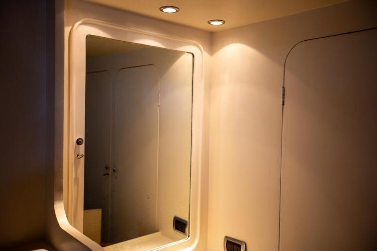 Interior of 1972 Benetti 33 yacht, featuring a mirror and recessed lighting.
